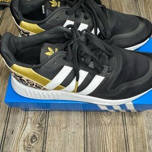 Adidas Black and Gold Sneakers